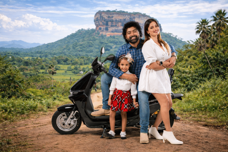 Family beside an iBIKE electric scooter in Sri Lanka